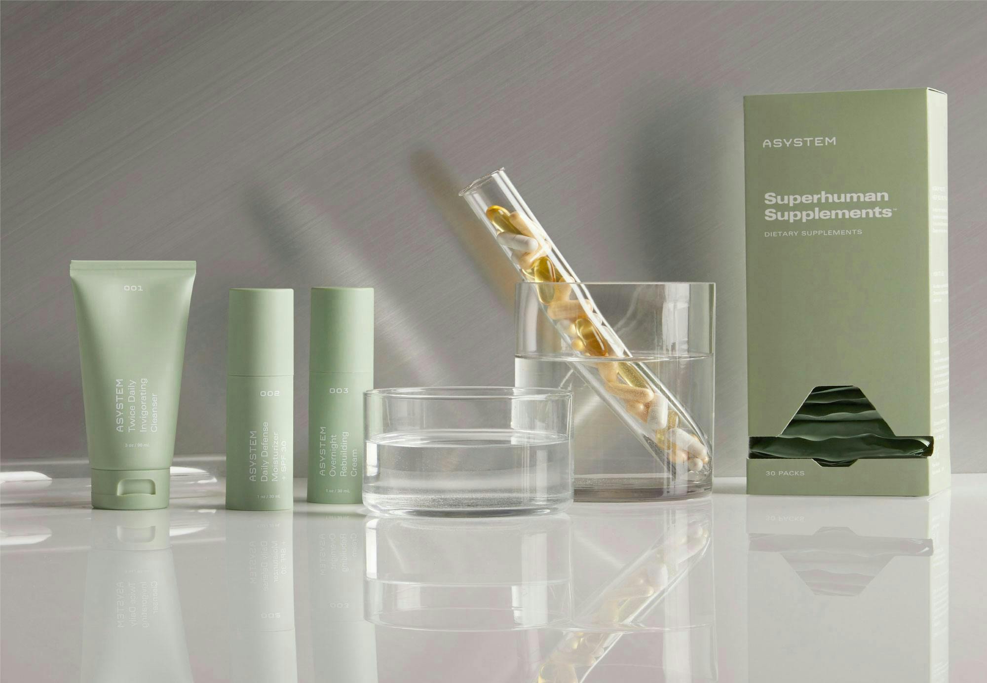 superhuman supplements photograph with green packaging on a grey table top against a grey backdrop 