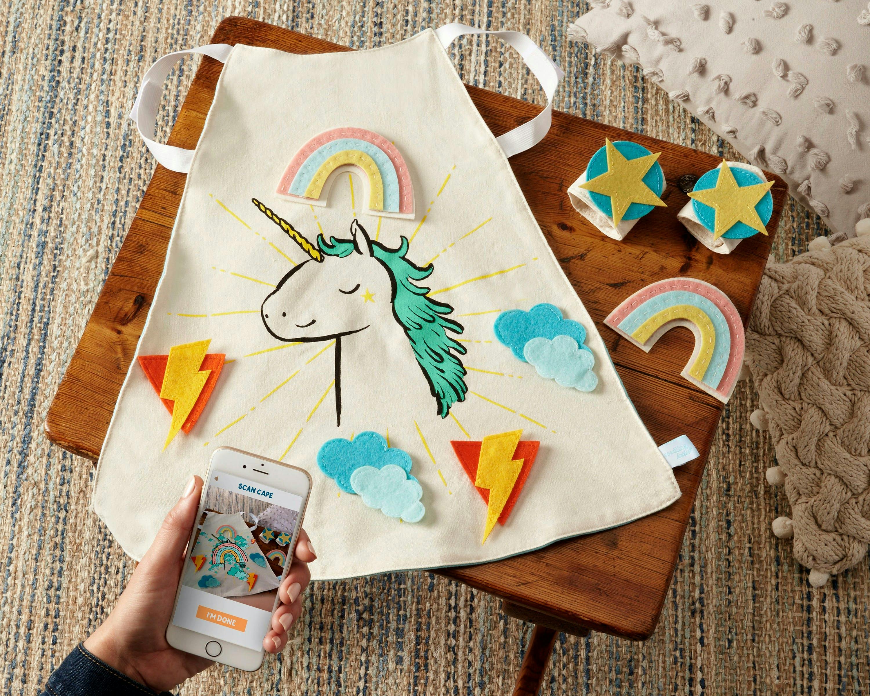 baby apron with unicorn and accessories with rainbows and stars 