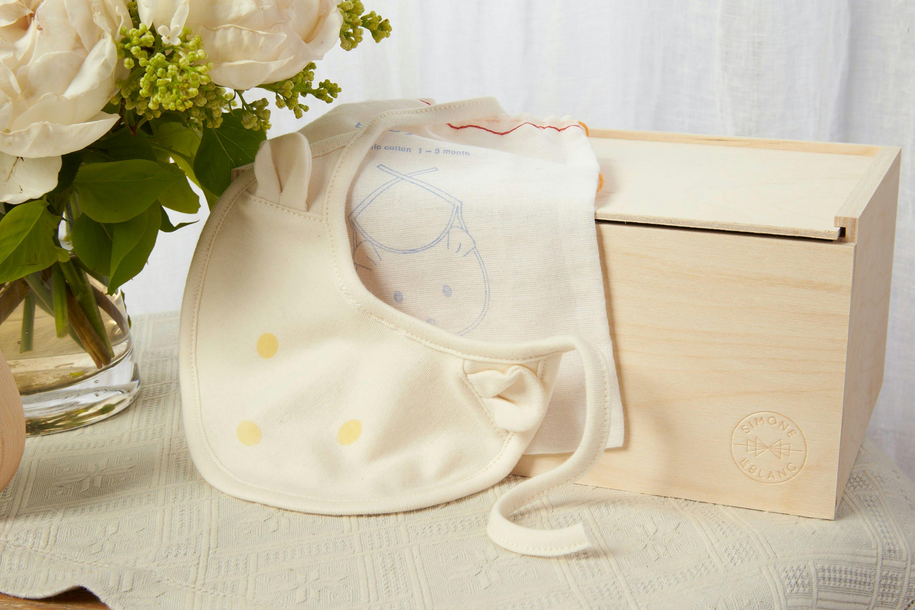 baby bibs and white roses high quality photography 